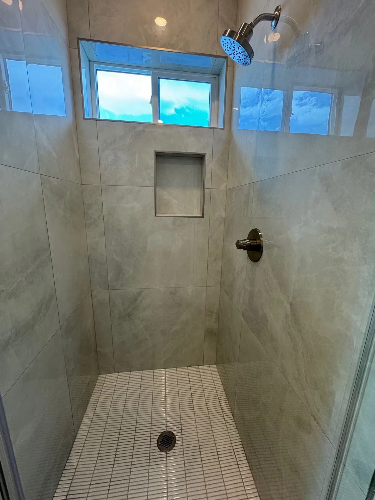 Fourth bedroom with recessed ceiling detail, natural light from dual windows, and consistent light oak hardwood throughout