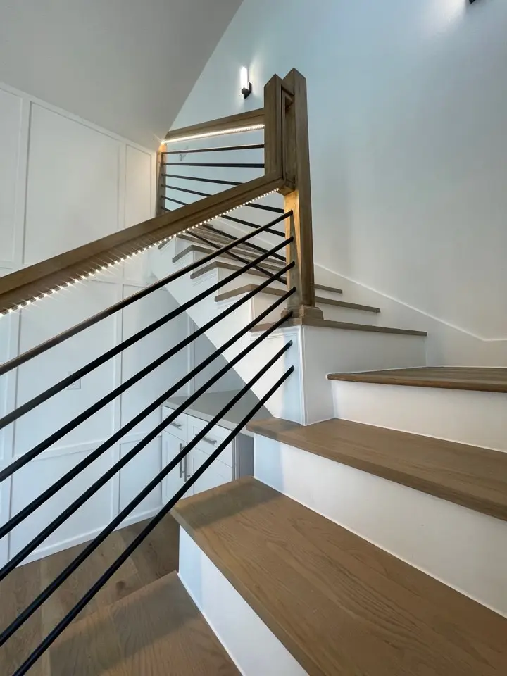 Architectural detail of the great room ceiling with recessed lighting and clean modern lines complementing the coastal design