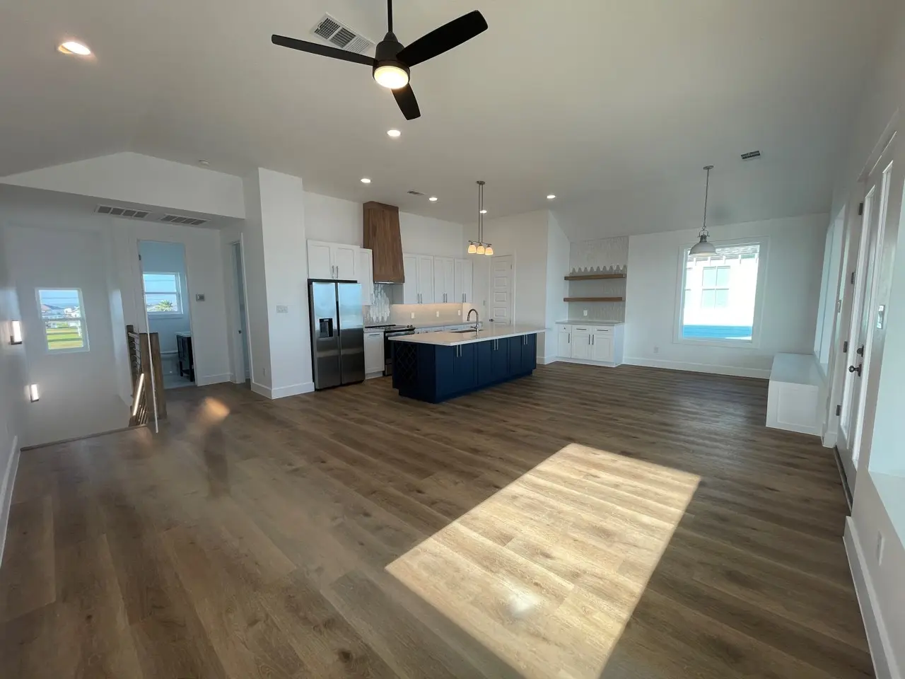 Guest bathroom with white subway tile shower, chrome fixtures, and light vanity complementing the coastal design throughout the home