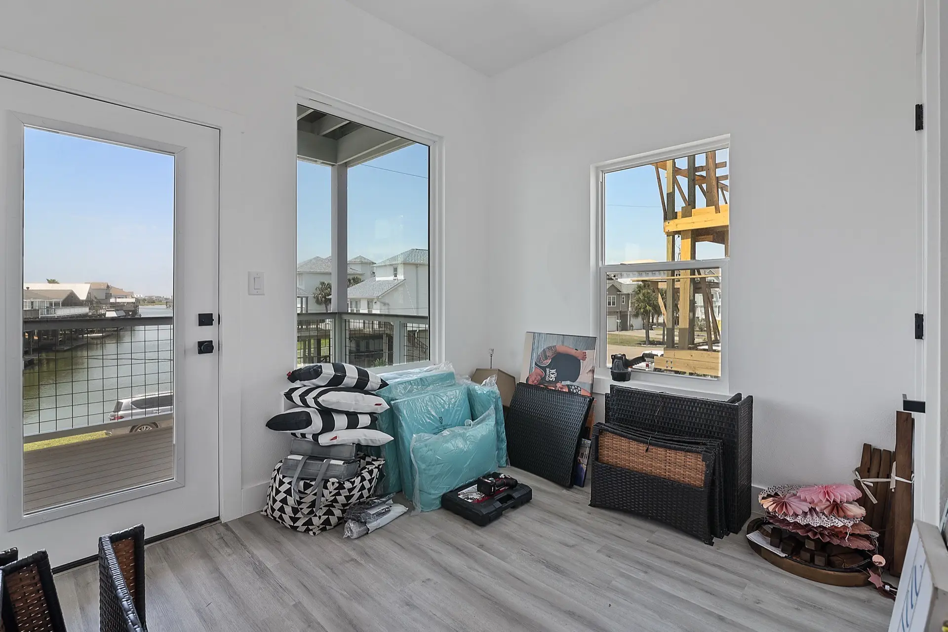 Kitchen prep area with white upper cabinets, glass-front doors, gold knobs, and hexagonal marble tile extending along the full backsplash wall