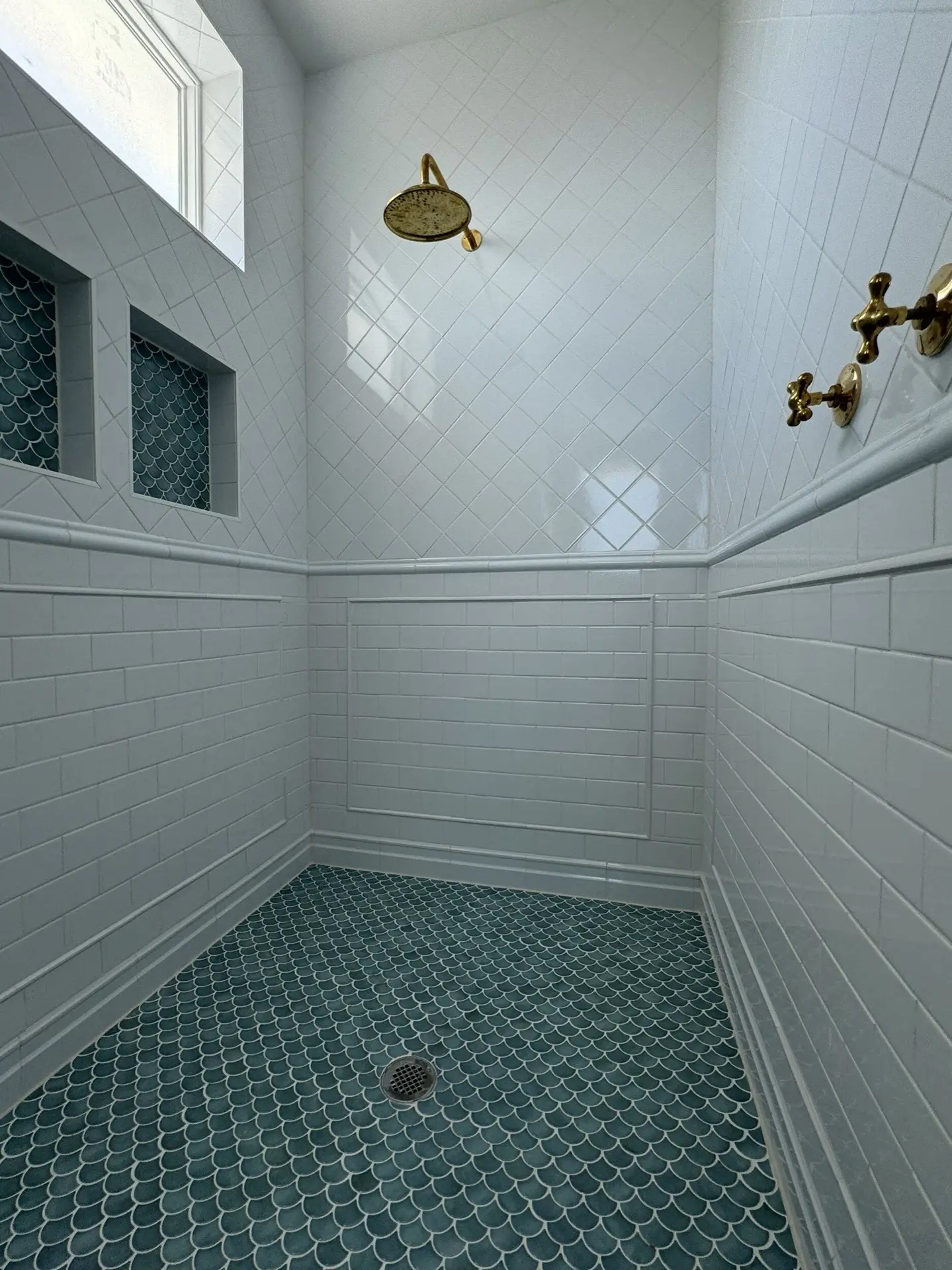 Master suite walk-in closet with custom built-in organization system, shelving, and ample storage in the Galveston waterfront home